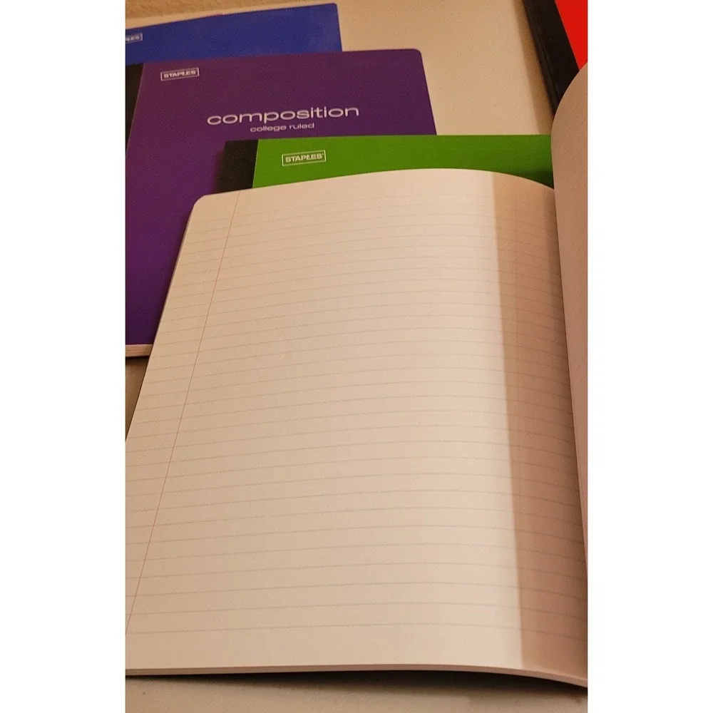 8 Staples Soft composition college ruled notebooks. 6 colors. 70 Pages.